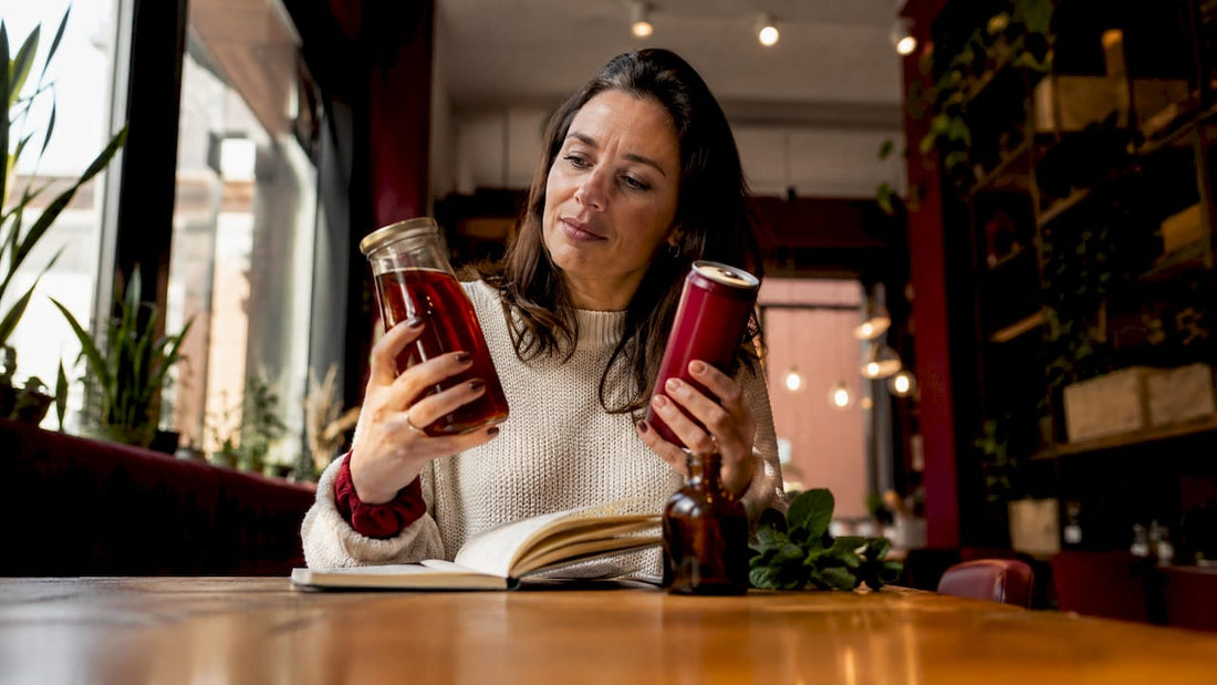 Nutritionist comparing kombucha and soda bottles