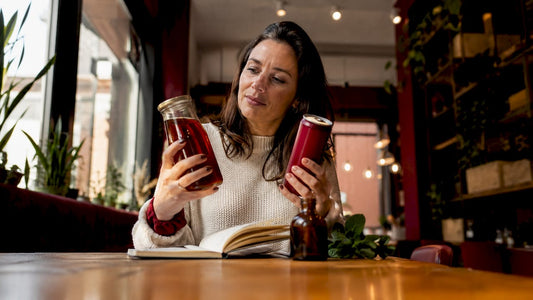 Nutritionist comparing kombucha and soda bottles
