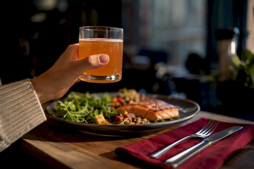 Kombucha served beside a meal